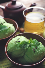 Homemade Green tea ice-cream on dark wooden background