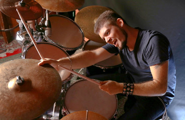 Drummer on dark background