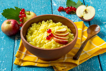 Useful millet porridge with apple and red currant