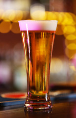 Cold beer glass on bar or pub desk