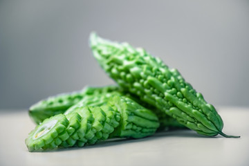 Karela bitter melon caraili studio close up grey background