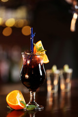 Cocktail on bar counter on bar background