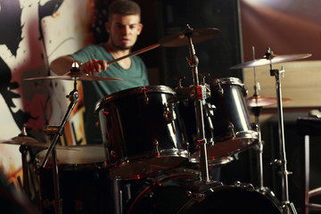 Drummer on dark background