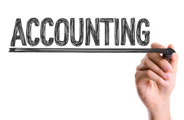 Hand with marker writing the word Accounting
