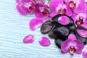 Violet orchid and zen stones close-up