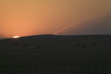 Sunset on hay field, near Pierre, South Dakota