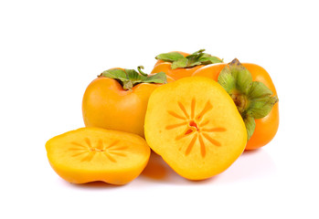 Fototapeta na wymiar Fresh persimmons on white background