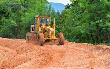 large grader  a narrow rural road