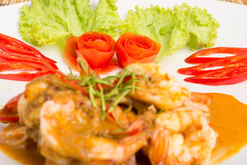 Curry fried shrimps and cooked rice