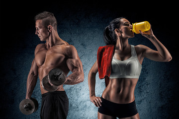 Athletic man and woman with a dumbells. - 90212206