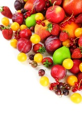 Naklejka na ściany i meble Heap of fresh fruits and berries isolated on white