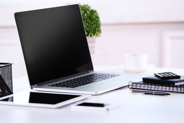 Modern workplace with laptop, close up