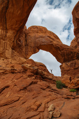 Man Raising Arms in Double Arch