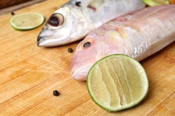 Fresh raw fish ,lemon and pepper