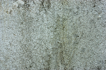 Textured walls with dirt.