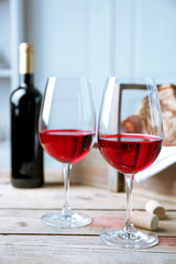 Still life of wine and bread on light background