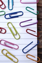 Paper notes with colorful paper clips