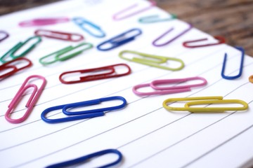 Paper notes with colorful paper clips