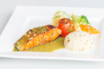Salmon steak on white plate