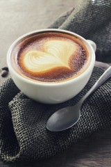 Vintage latte art coffee with beans