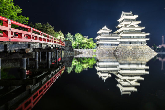 Matsumoto castle in the night time with the reflection in the water