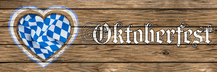 Obraz premium wooden oktoberfest background with heart shaped cut out and bavarian flag