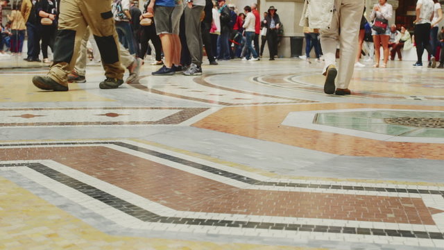 Masses Of People Walking On Marble Floor
