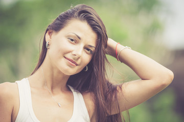 Obraz premium portrait of a beautiful brunette girl outdoor