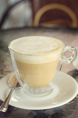 cup of cappuccino on the table in cafe