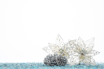 Silver Pine Cone with christmas decoration flower on Snow