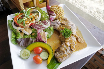 Pork chop steak with salad