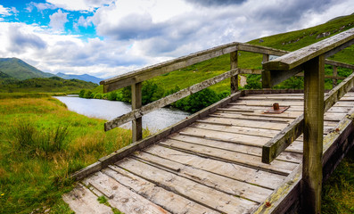 Fototapeta premium Wooden bridge across the river