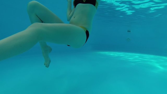 Swimming under the water.
