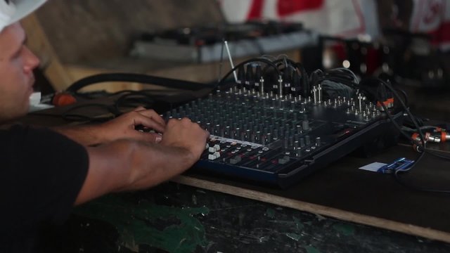 Man on the concert working on the beats