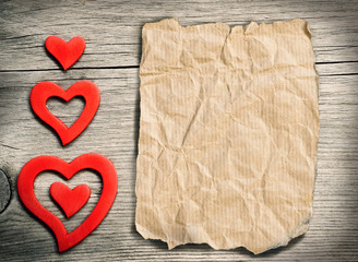 Fototapeta premium Red hearts on wood - retro background