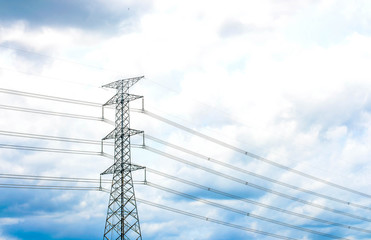 high voltage post with blue sky, selective focus point.