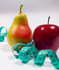 Apple, pear and tape measure, diet concept