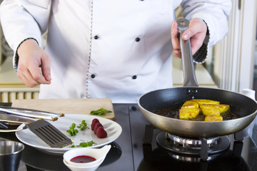 Japanese chef preparing a meal in a restaurant