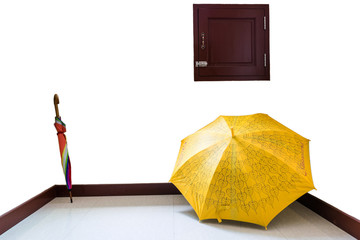 Colorful umbrellas placed in a corner of the room.