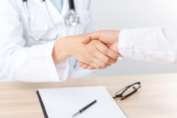 Professional doctor shaking hands