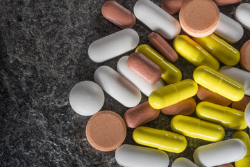 Stack of different colorful pills
