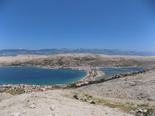 Sea, village, mountains and sky