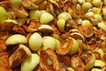 Sliced apples drying on a baking tray