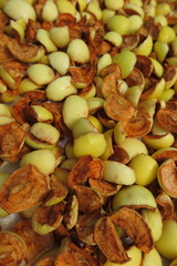 Sliced apples drying on a baking tray