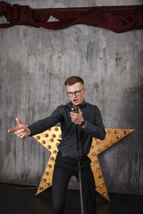 Young man singing with microphone