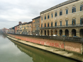 PISA, ITALY - JANUARY 8, 2015: Lungarni on a winter day. Pisa at