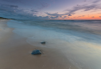 Baltic sea shore at beautiful sunset in Poland, Rowy near Ustka city