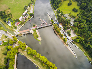 Hydroelectric plant on Elbe (Labe) River in Nymburk. Aerial view to industrial landscape with river in Czech Republic, Central Europe.