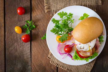 Sandwich with bacon and poached egg. Top view