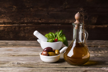 Olive oil with olives and basil